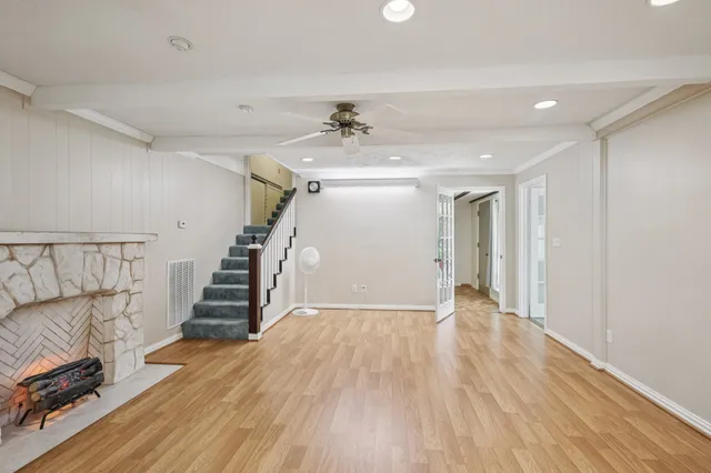 wooden floor in an empty room with a window