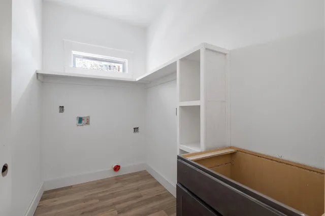 a view of a patio with table and chairs