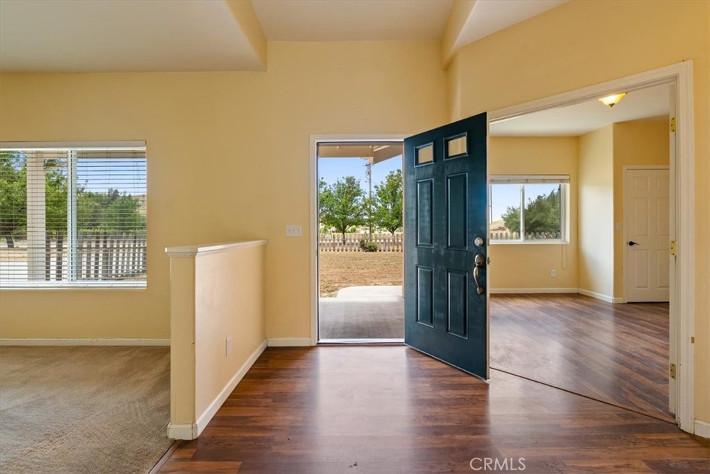 76846 Ranchita Canyon Road San Miguel, CA 93451 - Photo 6 of 51 a view of an empty room with wooden floor and a window