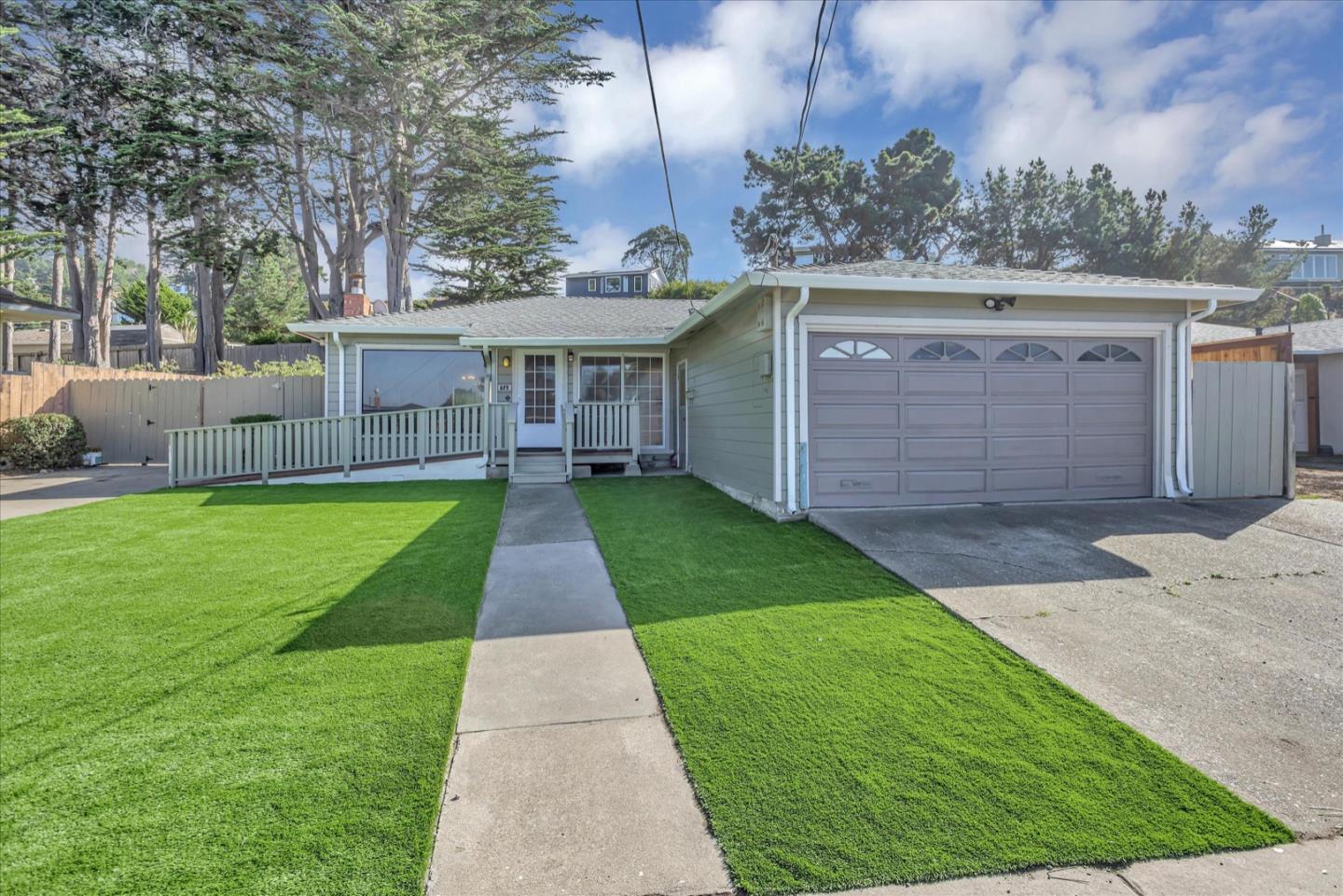 front view of a house with a yard