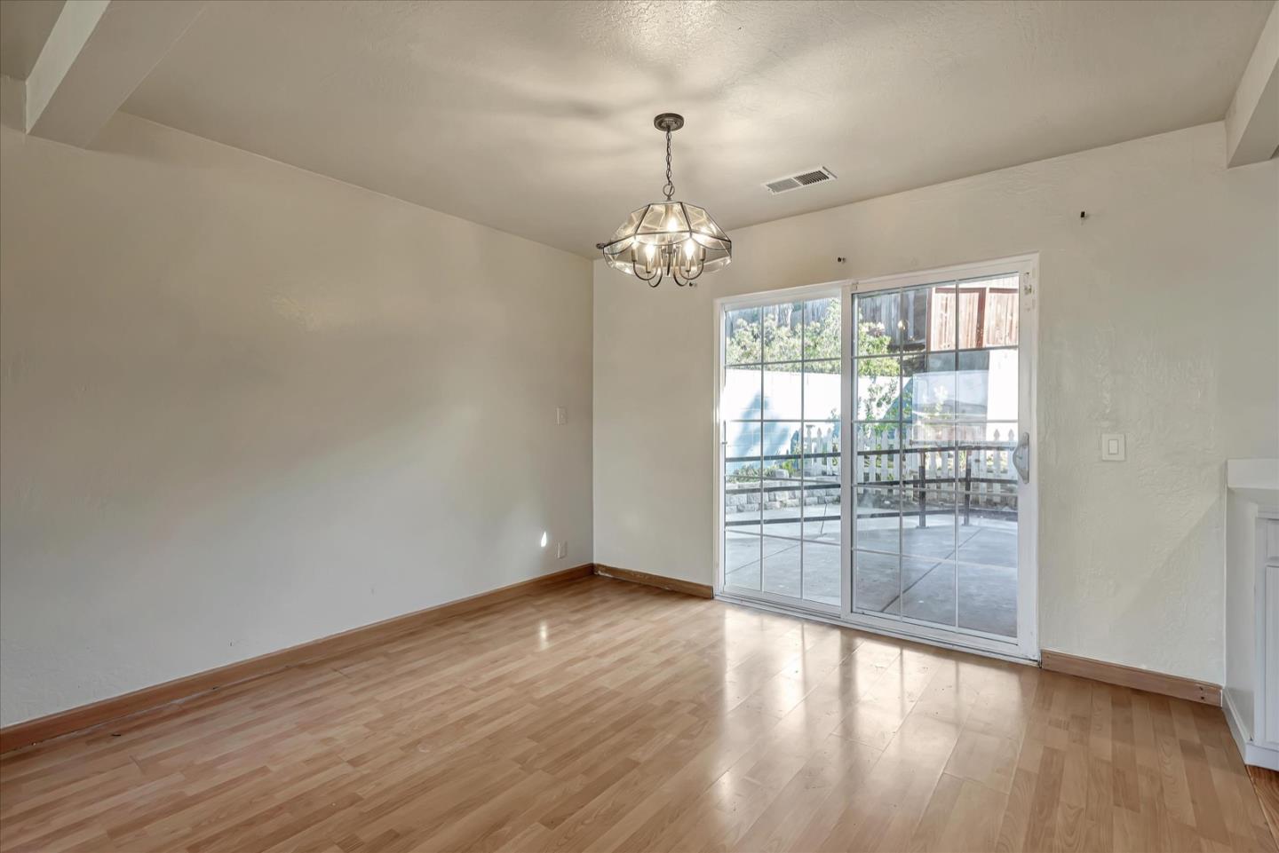 675 Crespi Drive Pacifica, CA 94044 - Photo 12 of 55 wooden floor in an empty room with a window