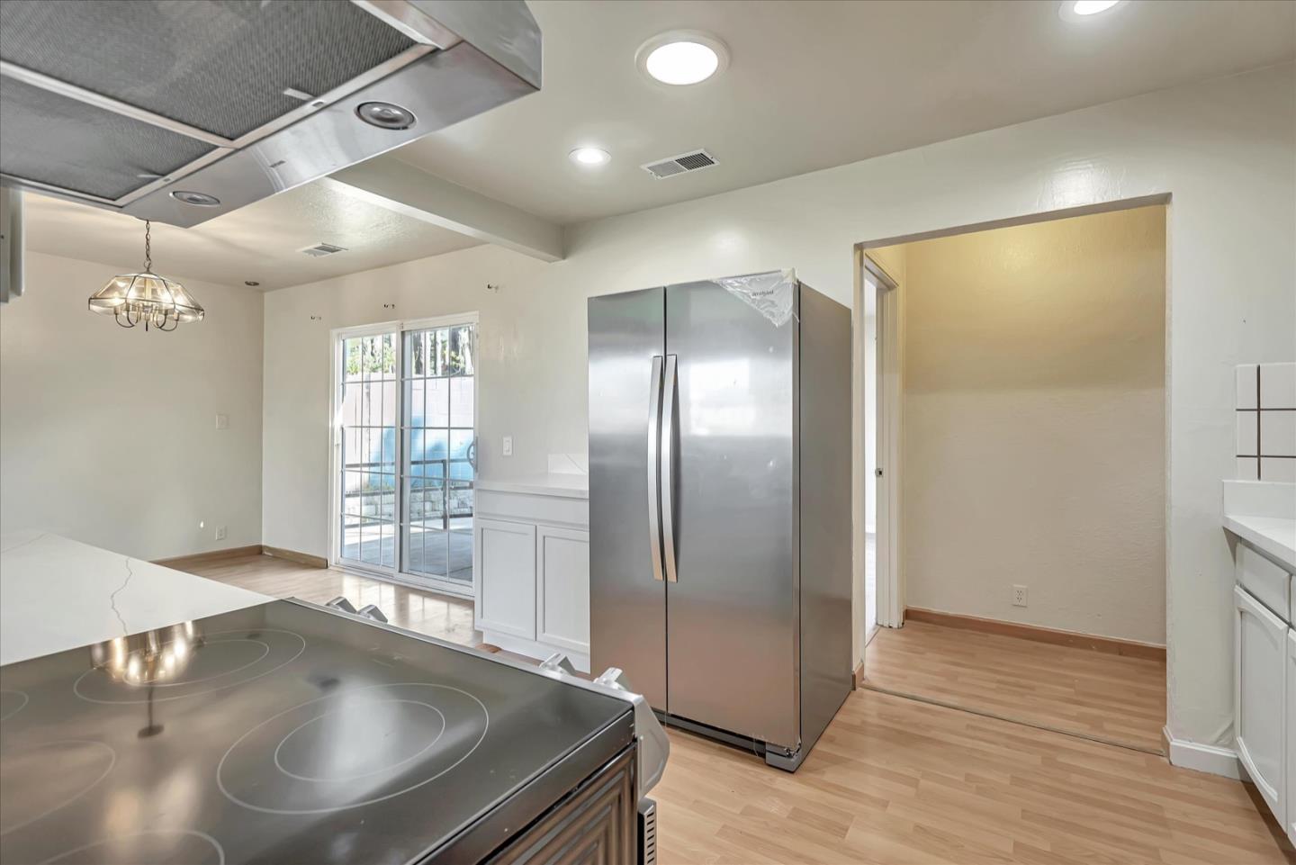 675 Crespi Drive Pacifica, CA 94044 - Photo 19 of 55 a kitchen with stainless steel appliances granite countertop a refrigerator a sink and a stove