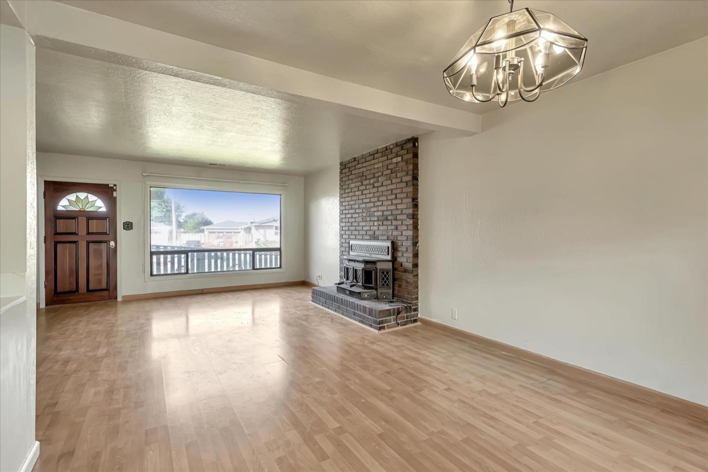 675 Crespi Drive Pacifica, CA 94044 - Photo 22 of 55 wooden floor in an empty room with a window