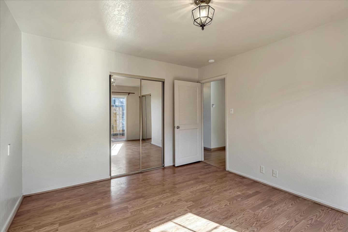 675 Crespi Drive Pacifica, CA 94044 - Photo 25 of 55 a view of empty room with wooden floor