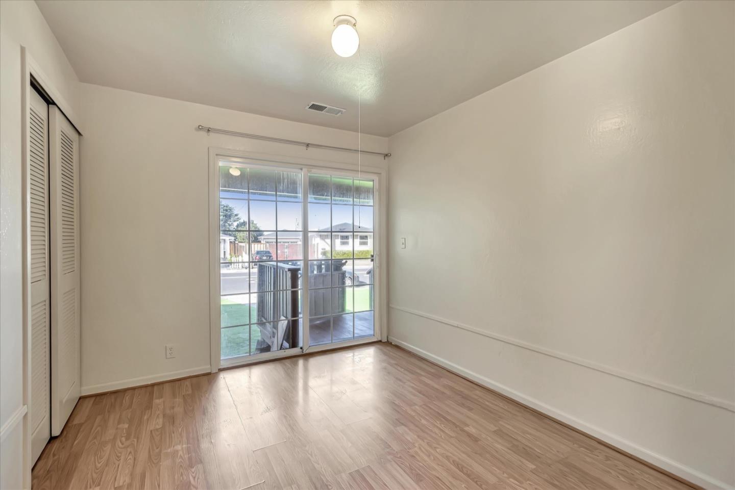 675 Crespi Drive Pacifica, CA 94044 - Photo 32 of 55 wooden floor in an empty room with a window