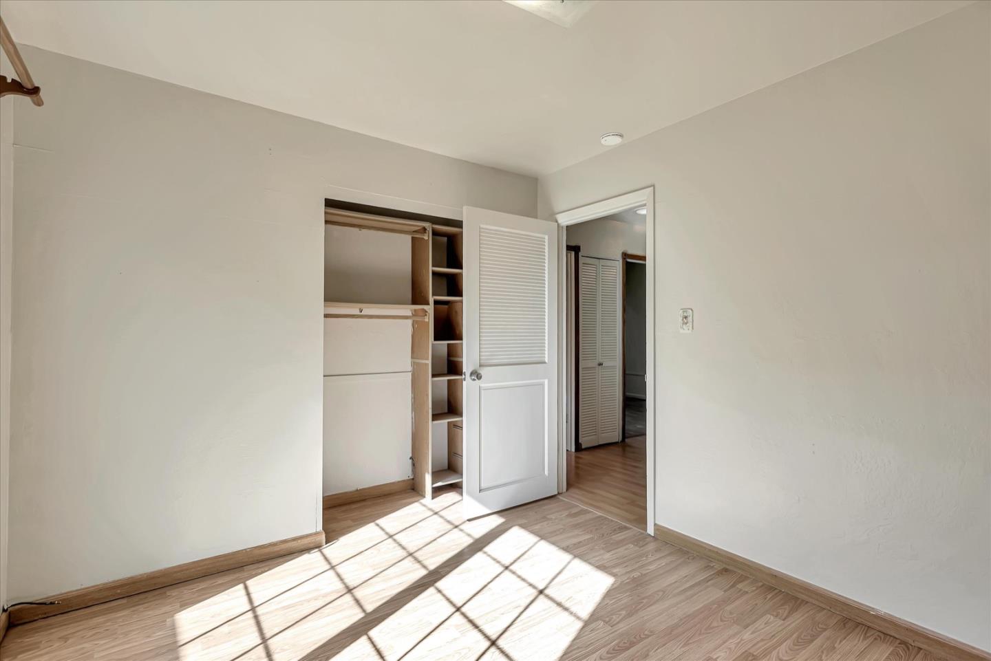 675 Crespi Drive Pacifica, CA 94044 - Photo 34 of 55 a view of an empty room with wooden floor and closet