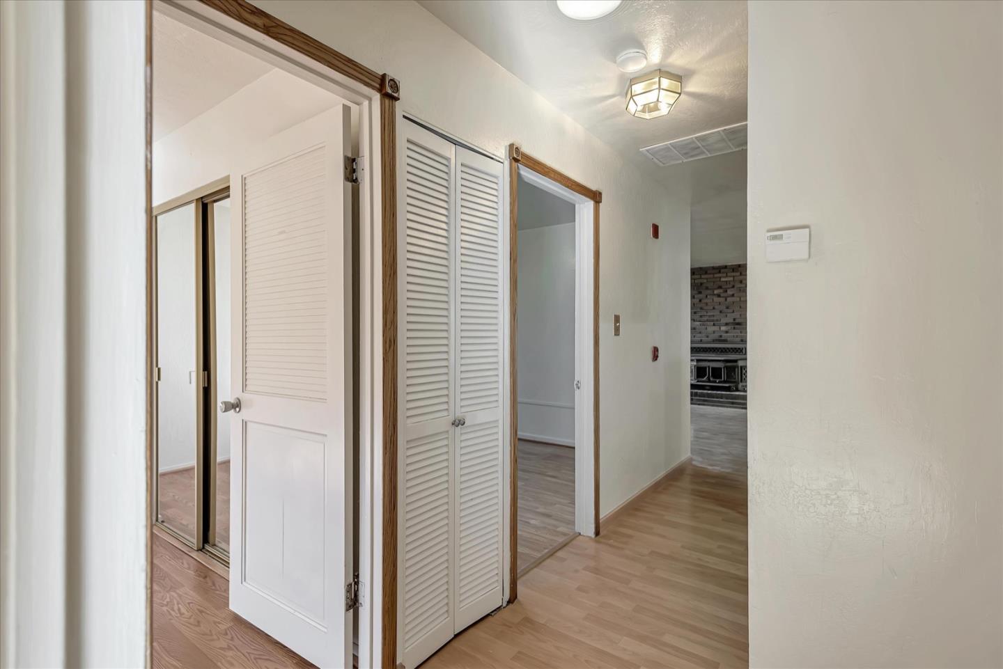 675 Crespi Drive Pacifica, CA 94044 - Photo 35 of 55 a view of a hallway with wooden floor