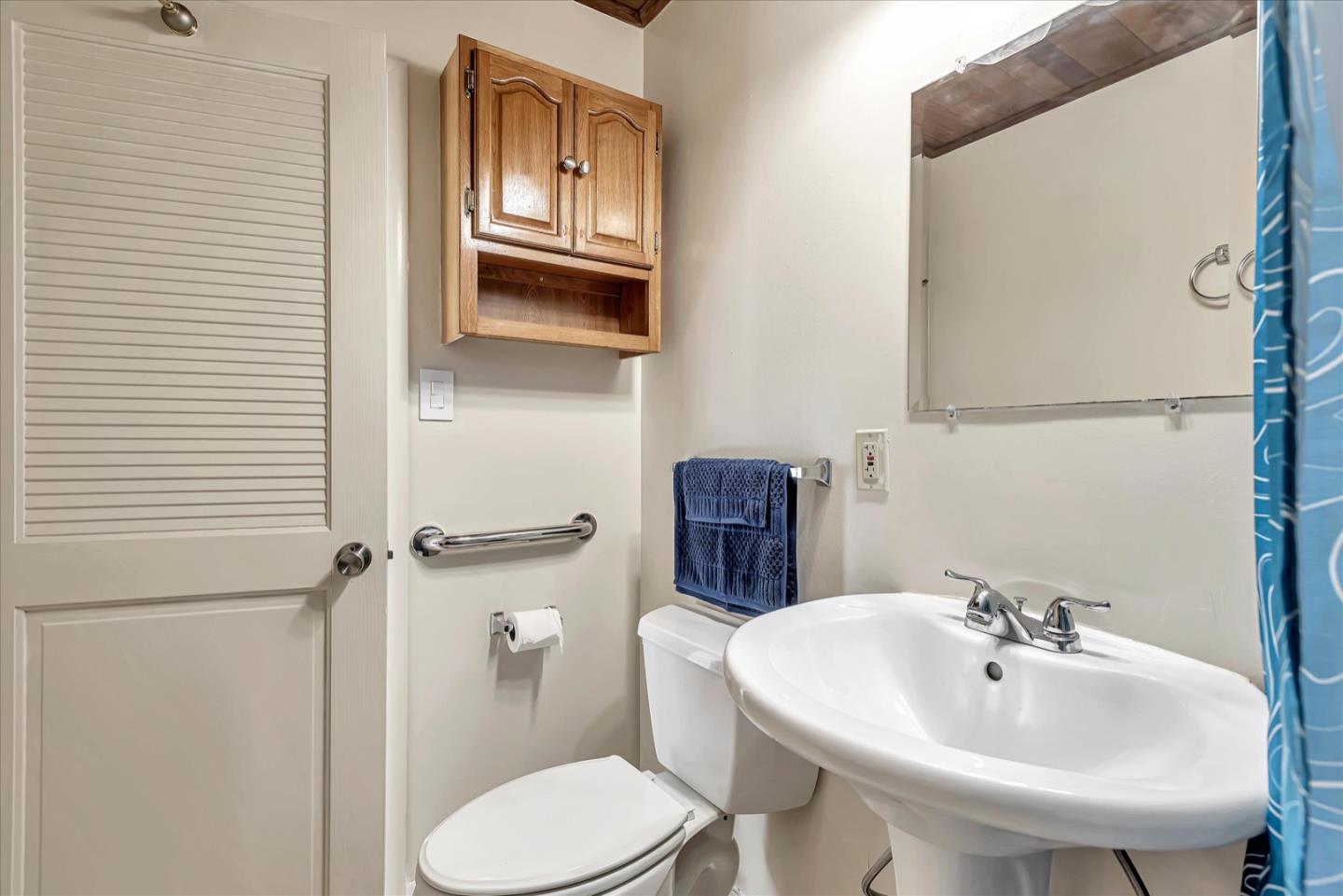 675 Crespi Drive Pacifica, CA 94044 - Photo 40 of 55 a bathroom with a sink and mirror