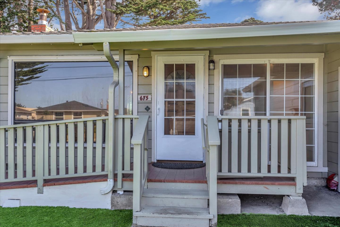675 Crespi Drive Pacifica, CA 94044 - Photo 4 of 55 a view of a house with a small yard and wooden floor and fence