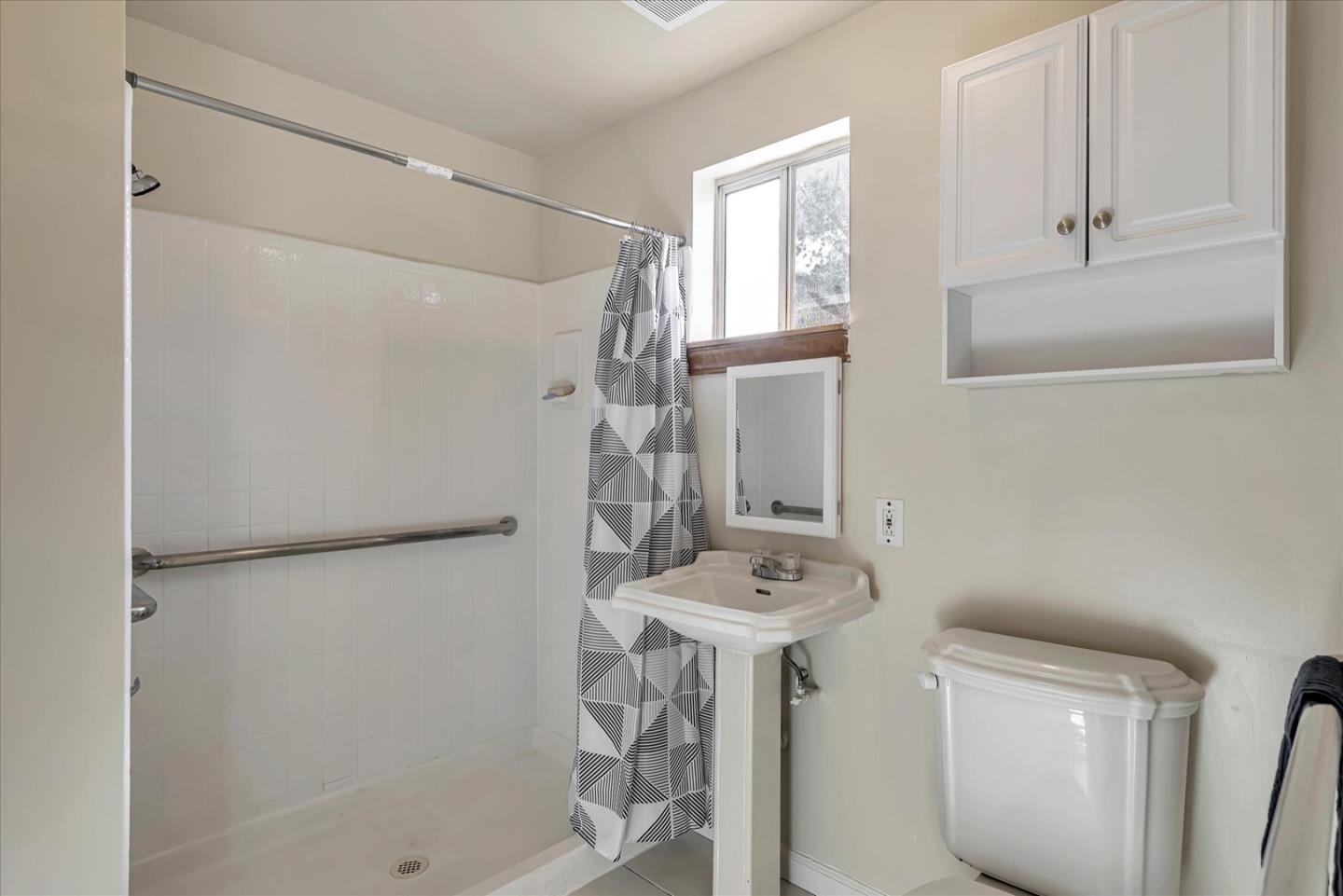 675 Crespi Drive Pacifica, CA 94044 - Photo 41 of 55 a bathroom with a sink toilet and shower