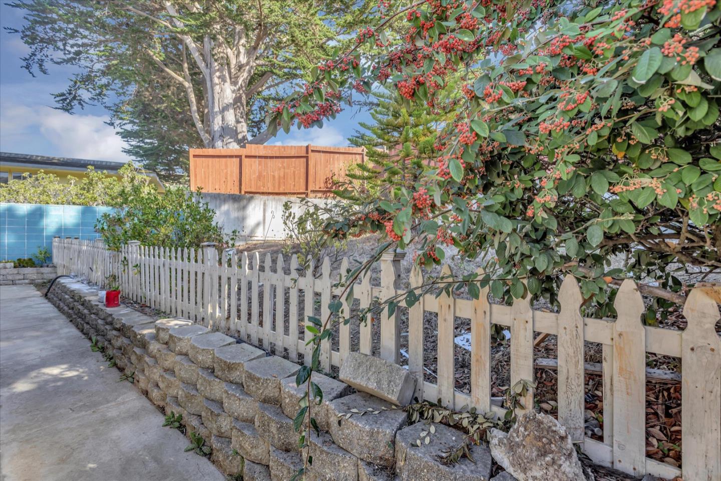 675 Crespi Drive Pacifica, CA 94044 - Photo 47 of 55 a view of a house with a small yard and wooden fence