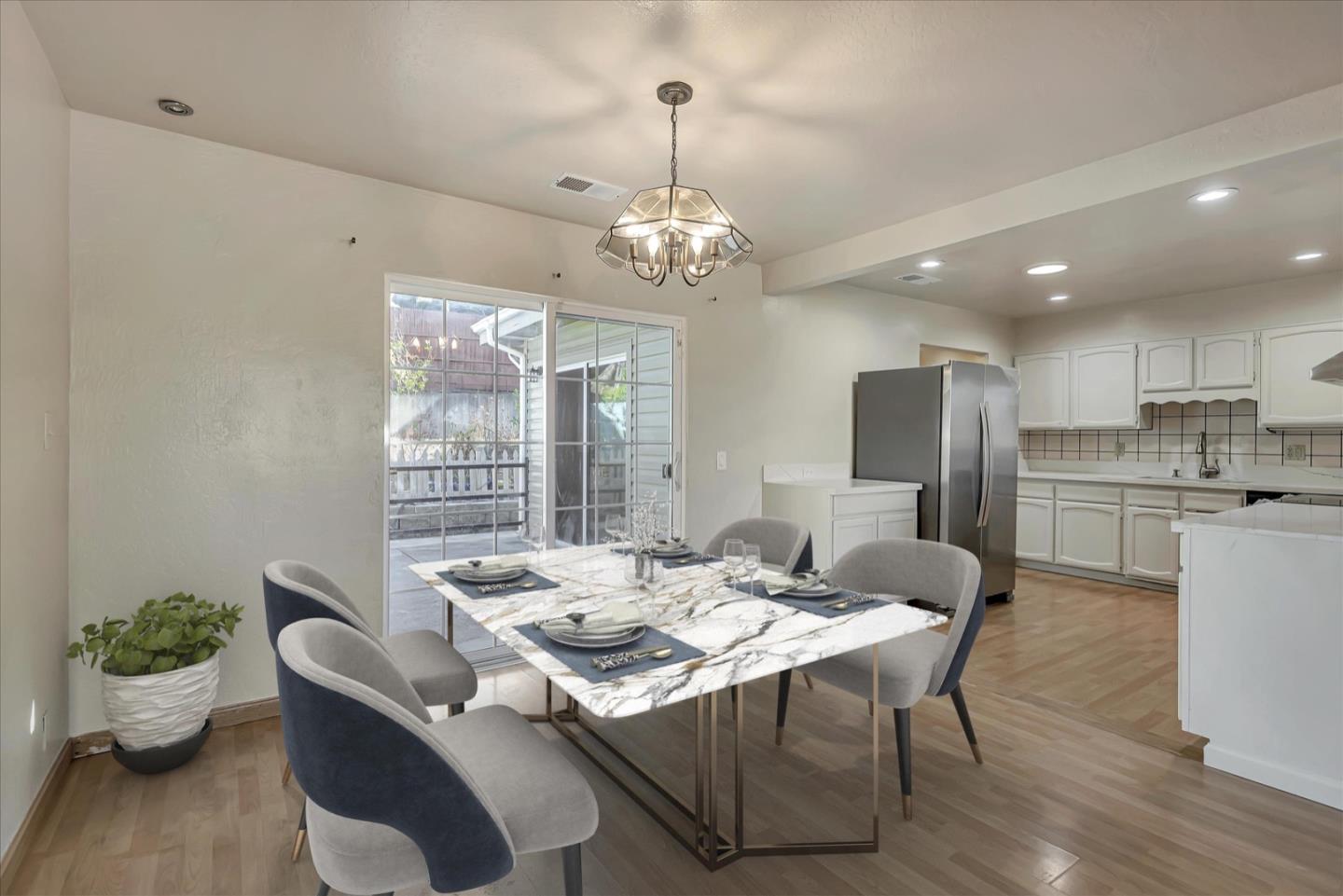 675 Crespi Drive Pacifica, CA 94044 - Photo 6 of 55 a view of a dining room with furniture wooden floor and chandelier