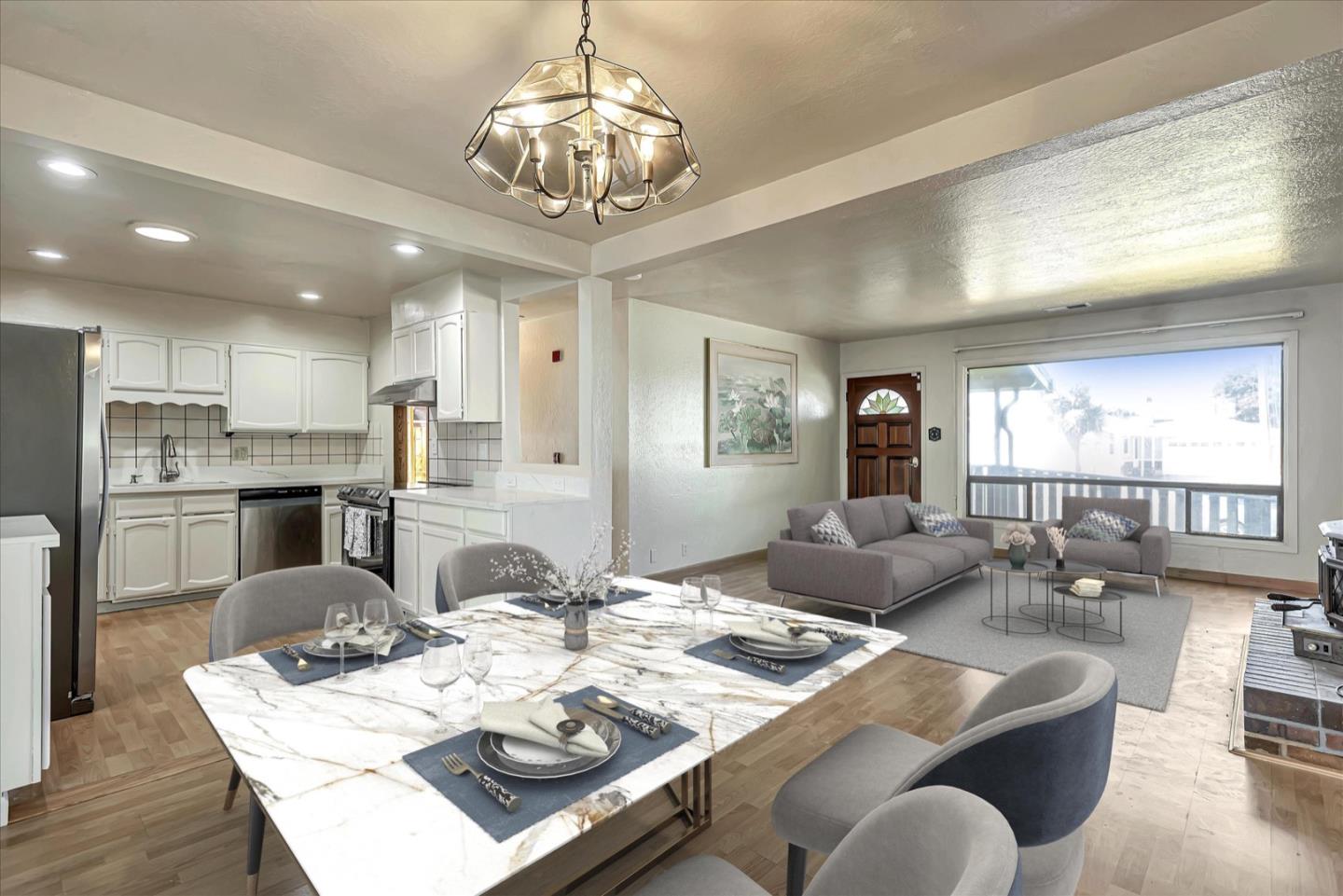 675 Crespi Drive Pacifica, CA 94044 - Photo 7 of 55 a view of a dining room with furniture a chandelier and wooden floor
