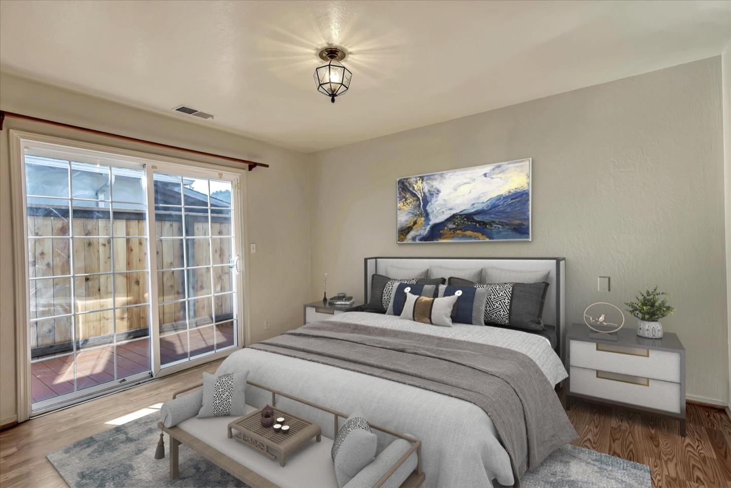 675 Crespi Drive Pacifica, CA 94044 - Photo 9 of 55 a bedroom with a bed and glass window