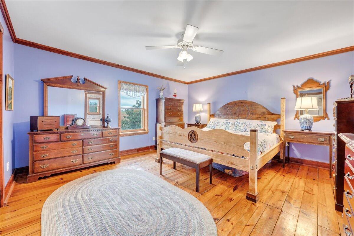 171 Cana Road Northeast Check, VA 24072 - Photo 54 of 131 a bedroom with a bed and wooden floor