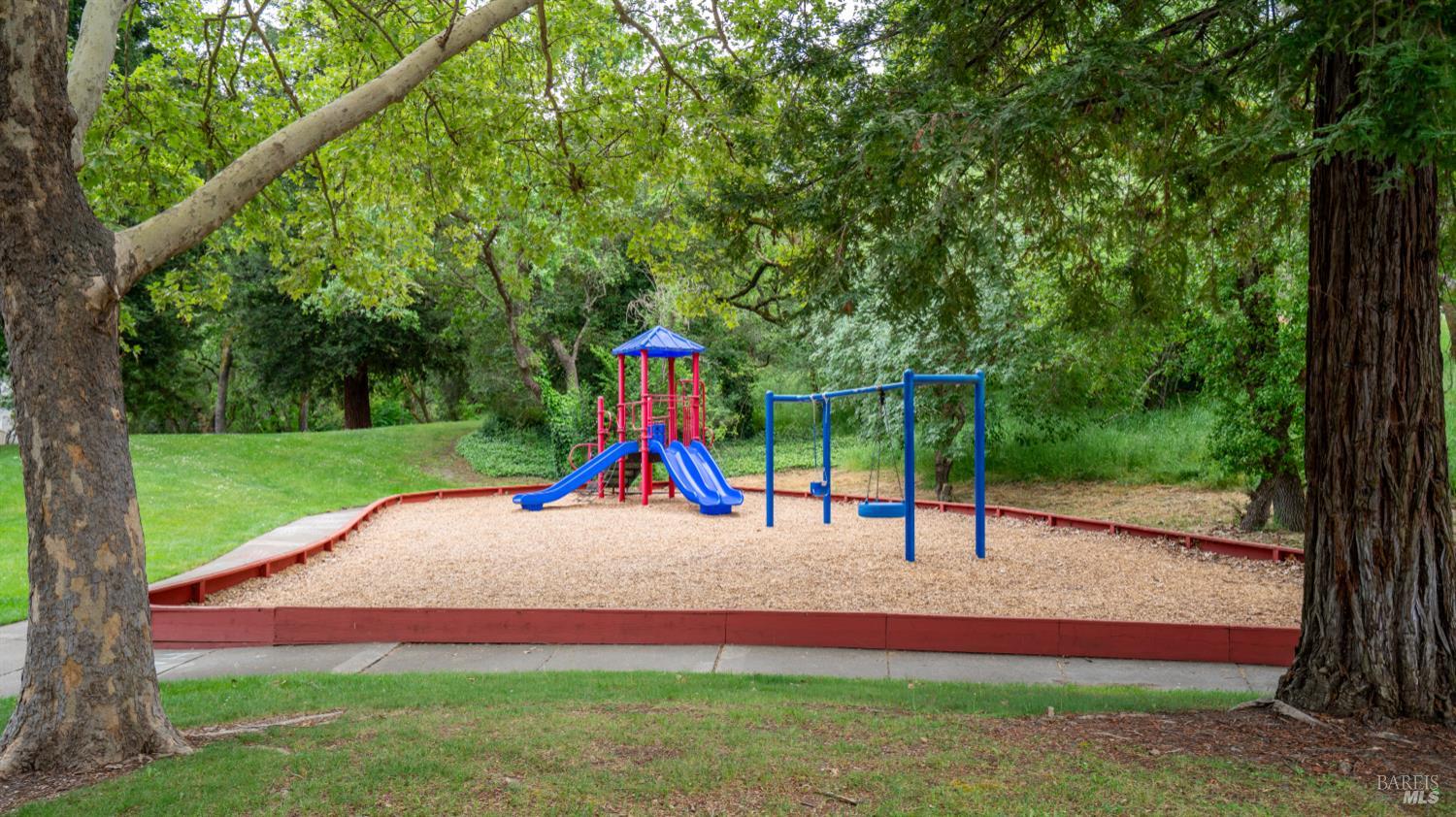 3335 Yulupa Avenue Santa Rosa, CA 95405 - Photo 36 of 39 The property features a playground area, offering a fun and convenient space for children to enjoy outdoor activities.
