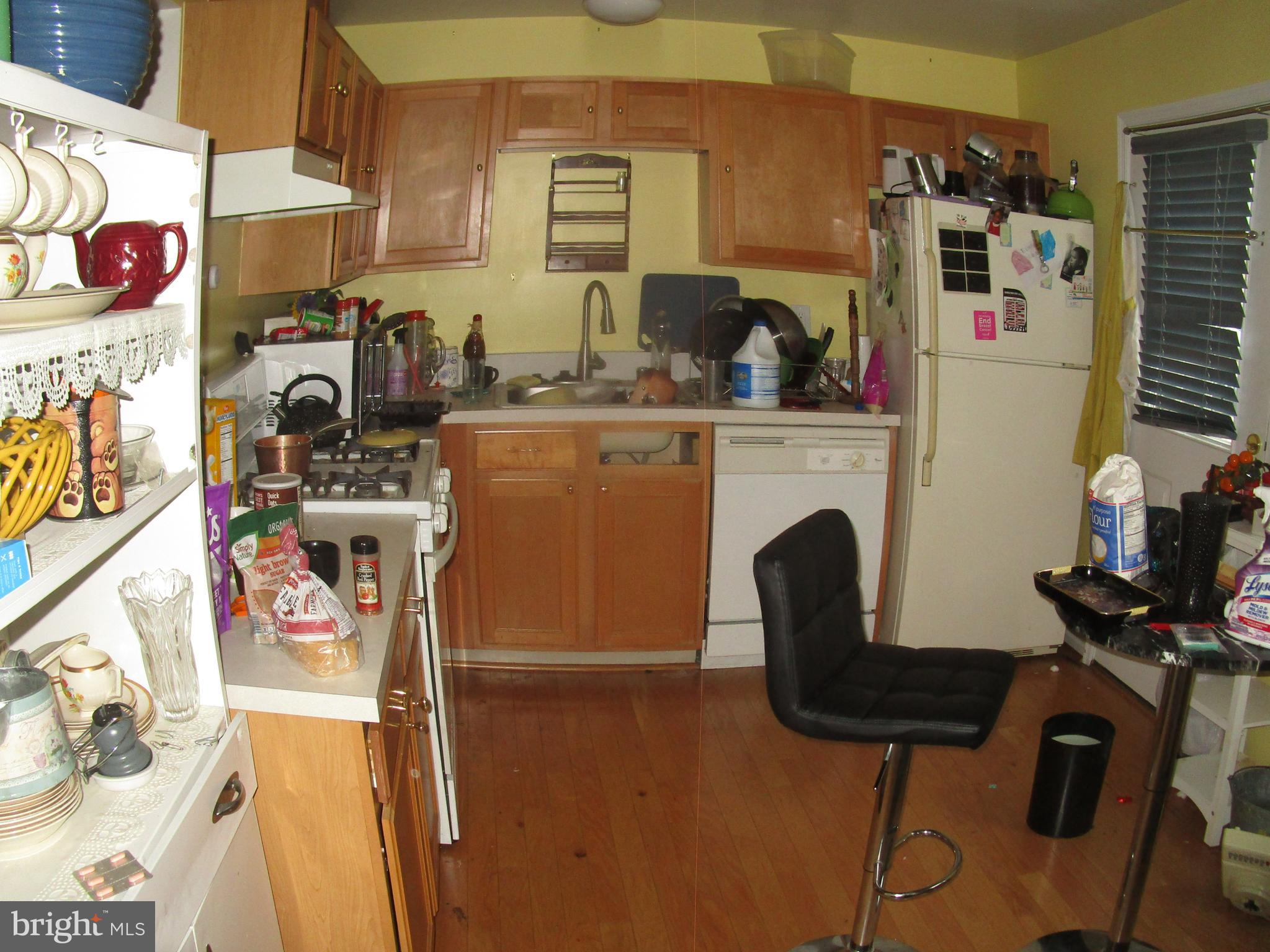 811 George Street Baltimore, MD 21201 - Photo 6 of 20 a kitchen with stainless steel appliances granite countertop a sink and cabinets