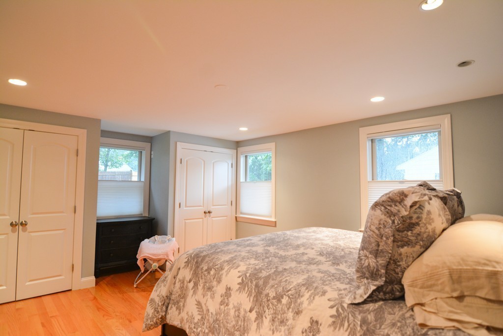 15 Melvin Road Arlington, MA 02474 - Photo 11 of 26 a bedroom with a bed and a window