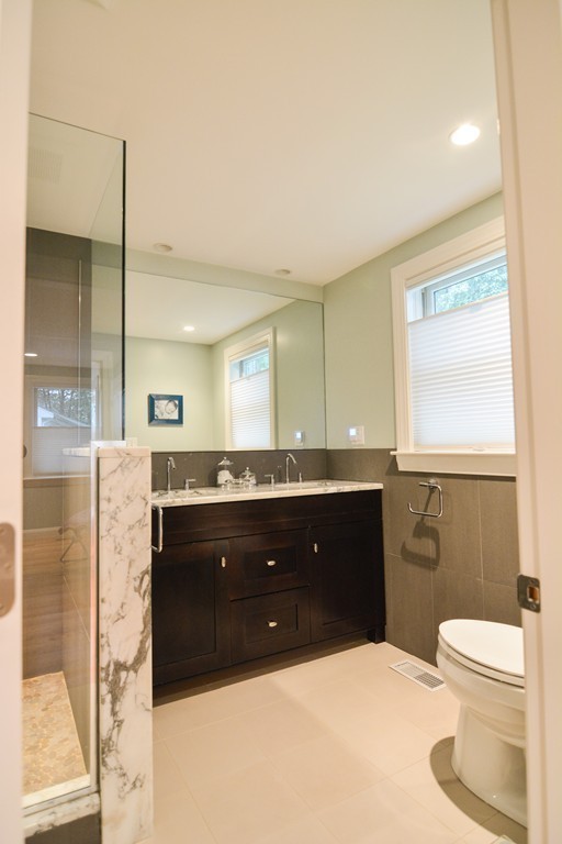 15 Melvin Road Arlington, MA 02474 - Photo 14 of 26 a bathroom with a sink a toilet and a bathtub