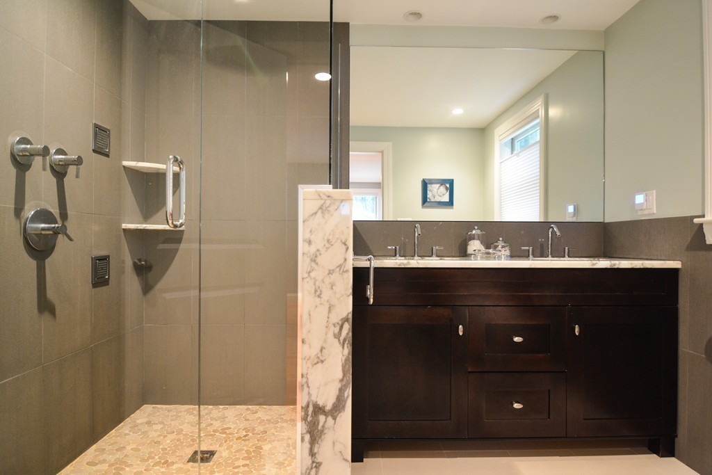 15 Melvin Road Arlington, MA 02474 - Photo 15 of 26 a bathroom with a granite countertop sink