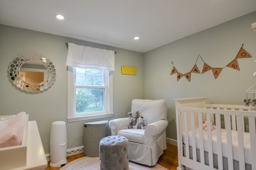 15 Melvin Road Arlington, MA 02474 - Photo 17 of 26 a bedroom with furniture and a window