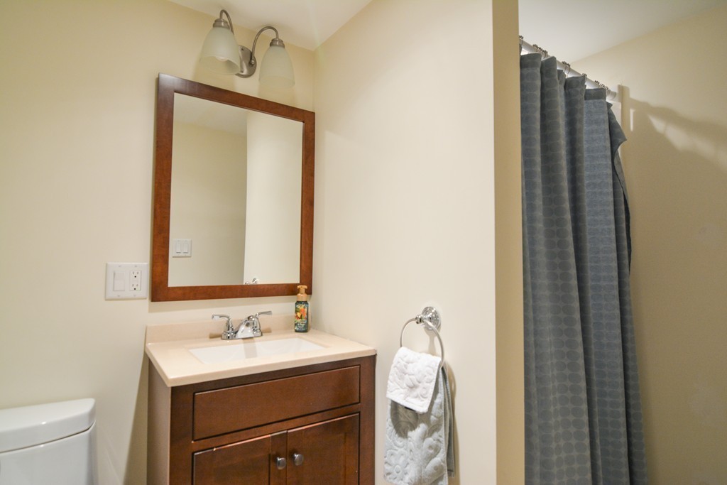 15 Melvin Road Arlington, MA 02474 - Photo 23 of 26 a bathroom with a sink vanity granite and toilet