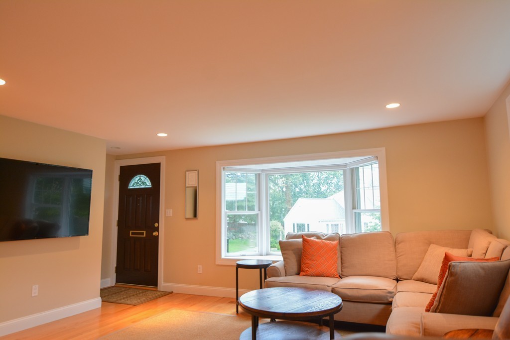 15 Melvin Road Arlington, MA 02474 - Photo 3 of 26 a living room with furniture and a large window