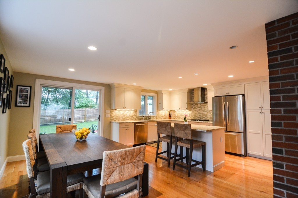 15 Melvin Road Arlington, MA 02474 - Photo 6 of 26 a view of a dining room with furniture window and wooden floor