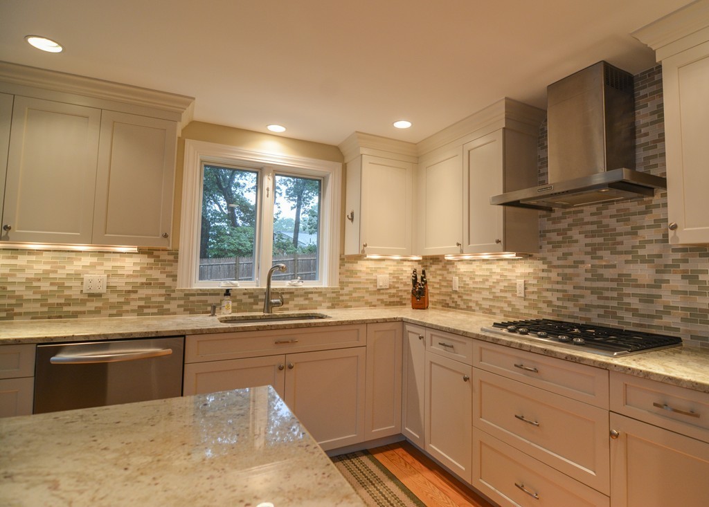 15 Melvin Road Arlington, MA 02474 - Photo 9 of 26 a kitchen with a sink stove and cabinets