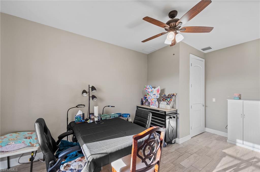 4914 Seton Way Immokalee, FL 34142 - Photo 19 of 46 Home office with light wood-type flooring and a ceiling fan