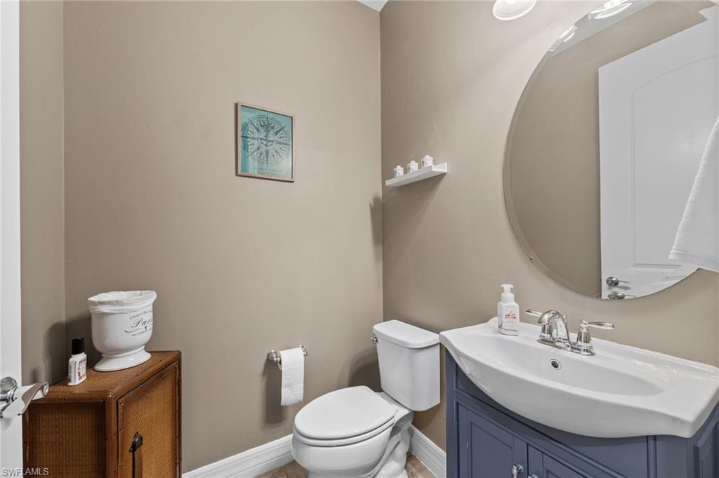 4914 Seton Way Immokalee, FL 34142 - Photo 20 of 46 Half bathroom with vanity and toilet