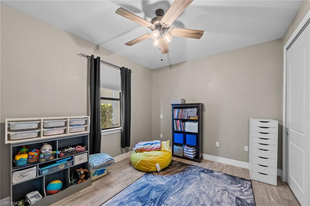 4914 Seton Way Immokalee, FL 34142 - Photo 21 of 46 Rec room with wood tiled floors and ceiling fan