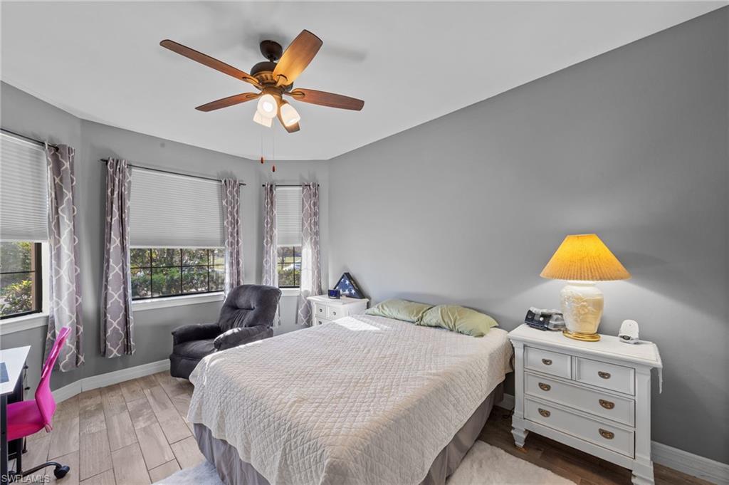 4914 Seton Way Immokalee, FL 34142 - Photo 24 of 46 Bedroom with wood finish floors and a ceiling fan