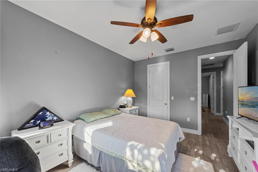 4914 Seton Way Immokalee, FL 34142 - Photo 25 of 46 Bedroom with light wood-style flooring, ceiling fan, and a closet