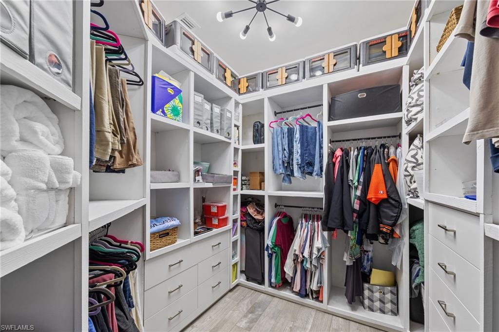 4914 Seton Way Immokalee, FL 34142 - Photo 30 of 46 Walk in closet featuring light wood-style floors