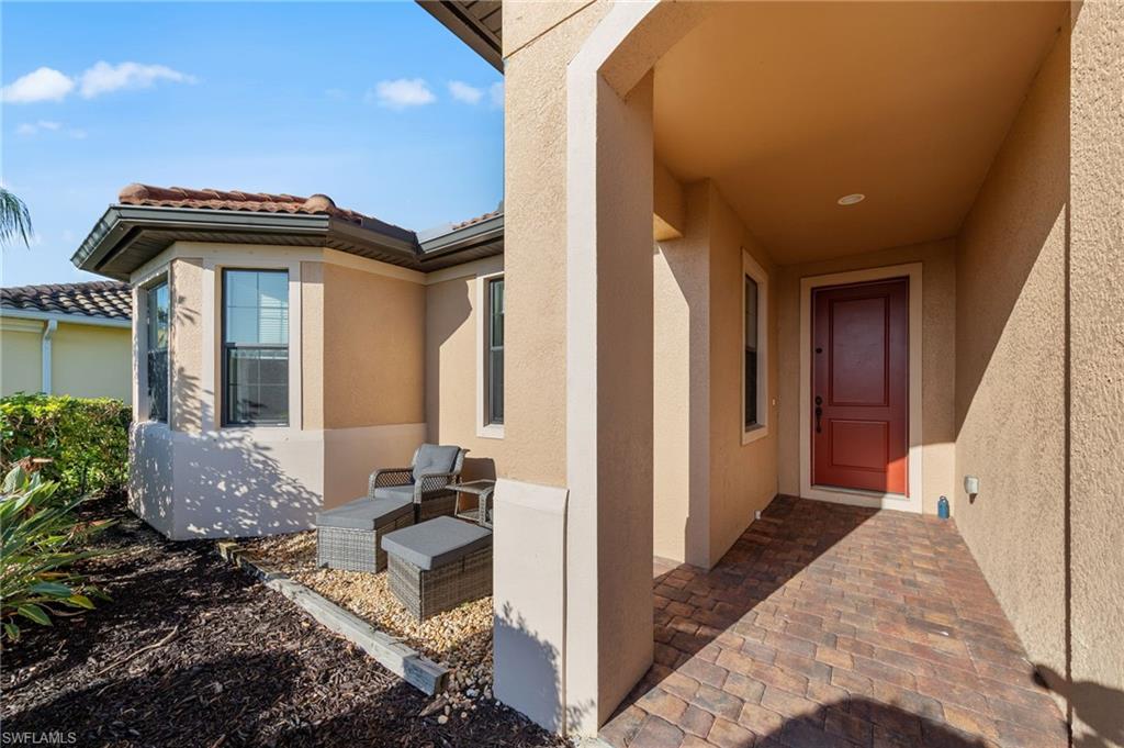 4914 Seton Way Immokalee, FL 34142 - Photo 3 of 46 Entrance to property featuring stucco siding, a patio, and a tile roof