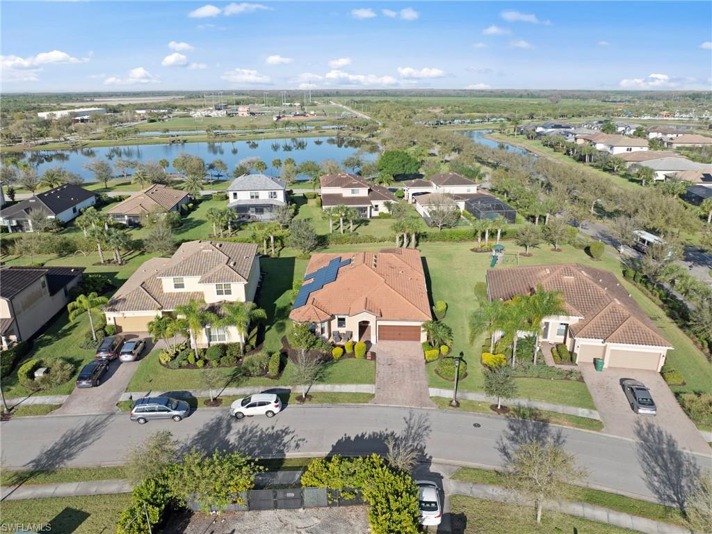4914 Seton Way Immokalee, FL 34142 - Photo 39 of 46 Aerial view of residential area featuring a nearby body of water