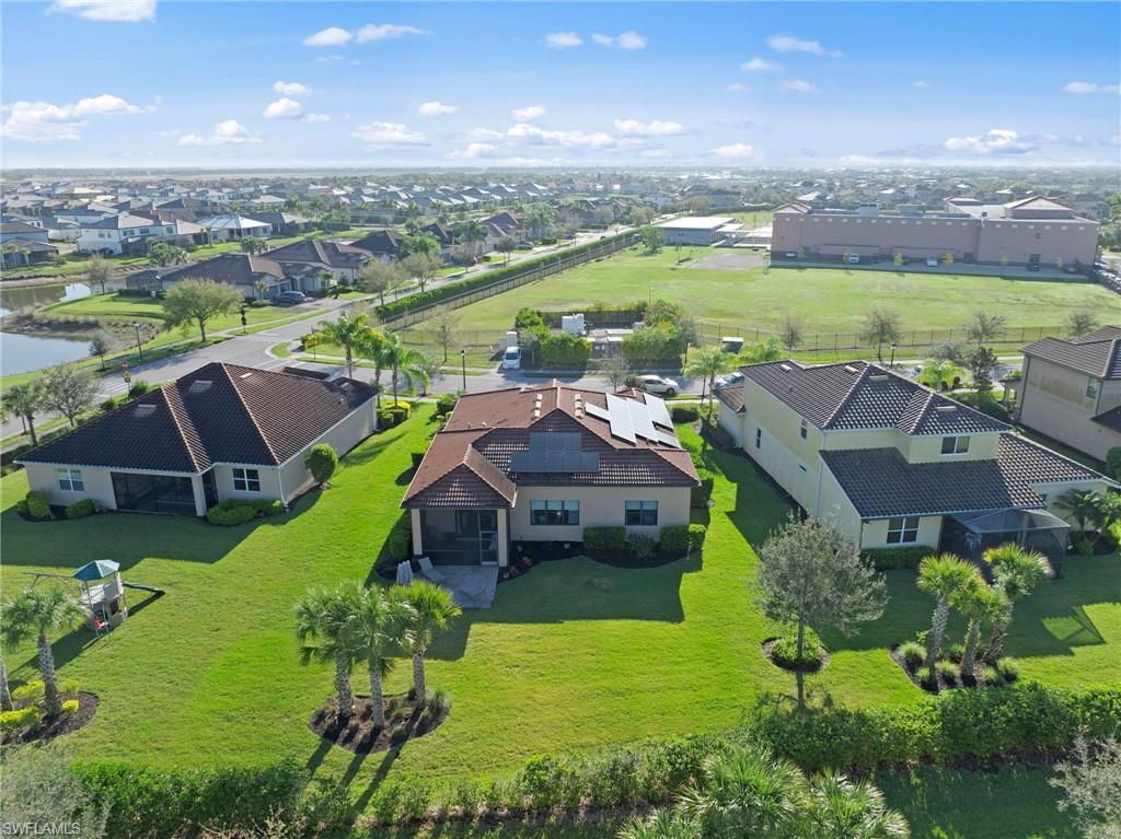 4914 Seton Way Immokalee, FL 34142 - Photo 42 of 46 Aerial perspective of suburban area featuring a nearby body of water