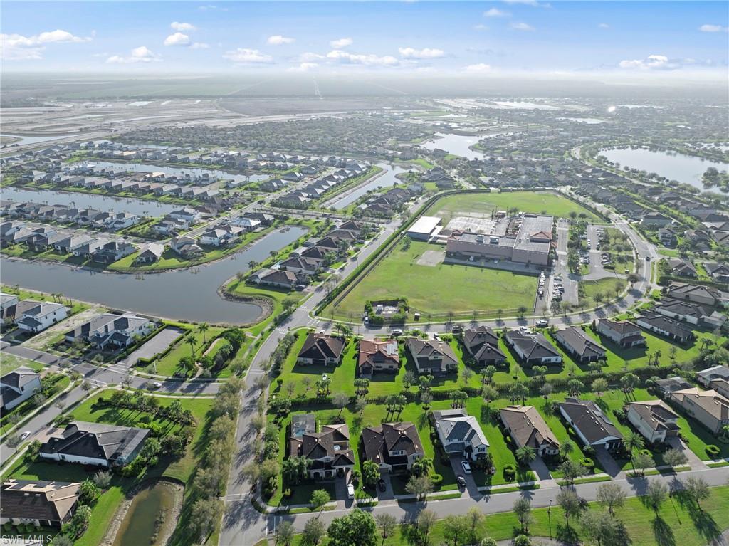 4914 Seton Way Immokalee, FL 34142 - Photo 44 of 46 Aerial view of residential area featuring a large body of water