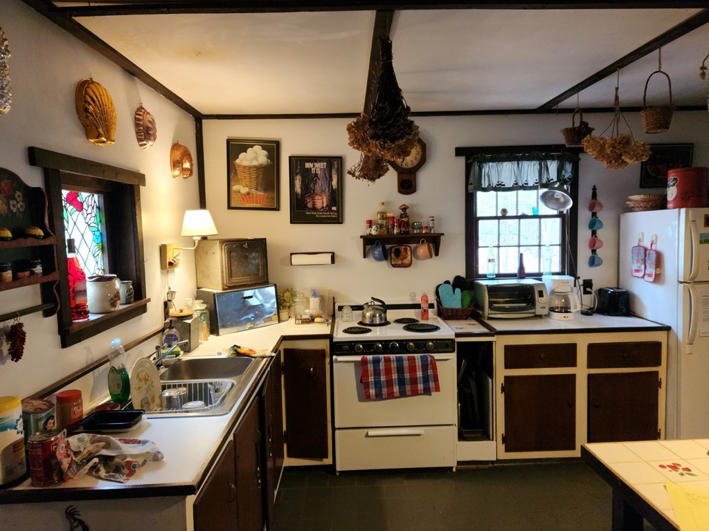2 Sassamon Trail Marion, MA 02738 - Photo 9 of 10 a kitchen with a stove and a refrigerator