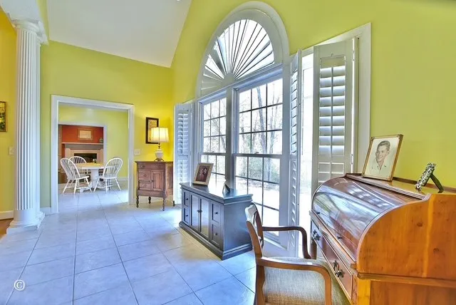 a view of a livingroom with furniture and a window