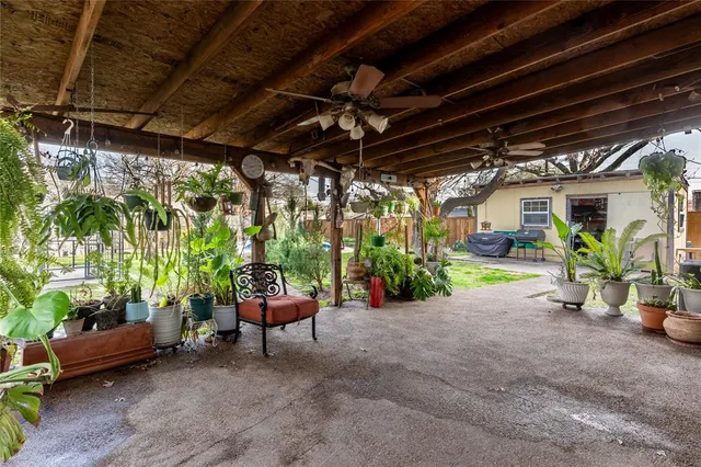 a view of a chairs and table in a patio