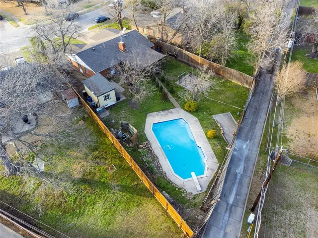 a aerial view of a house with swimming pool