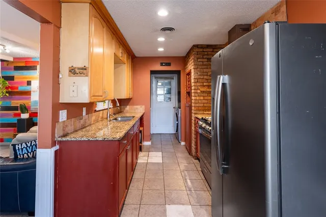 a bathroom with a sink a mirror and a shower