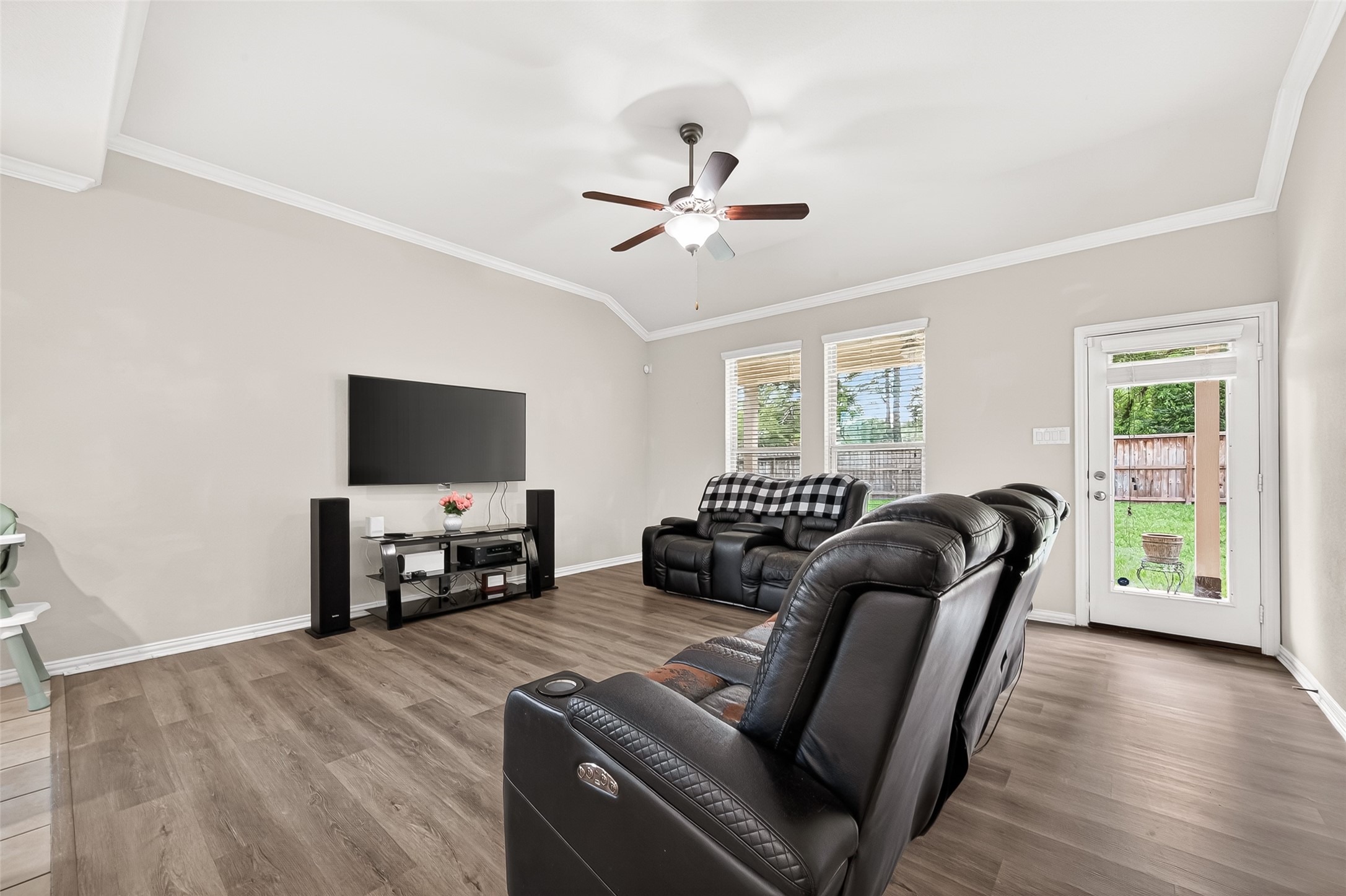 8 Landscape Court Conroe, TX 77301 - Photo 7 of 43 a living room with furniture and a flat screen tv