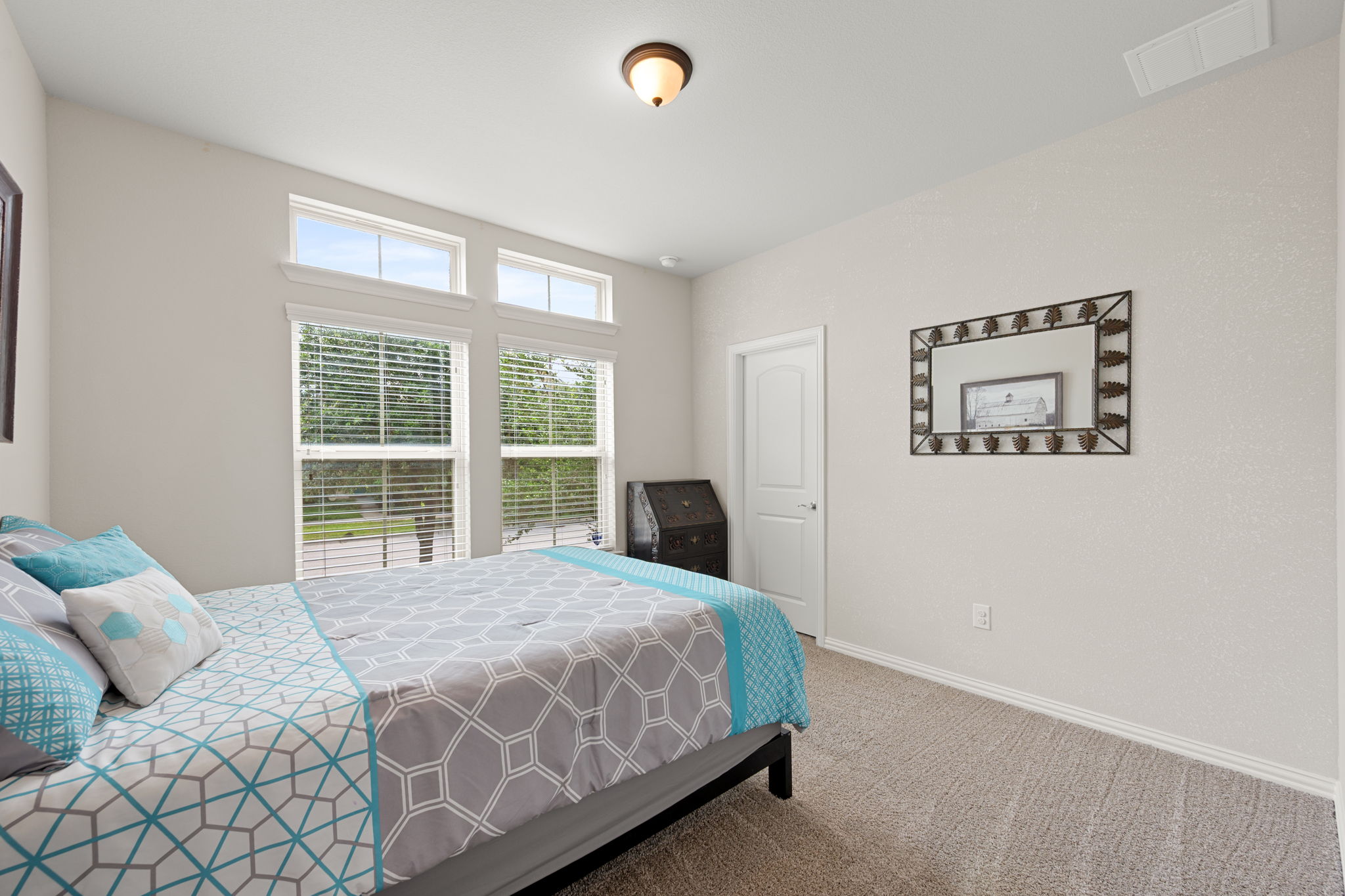 8800 Slater Drive Austin, TX 78747 - Photo 21 of 40 a bedroom with a large bed and a window