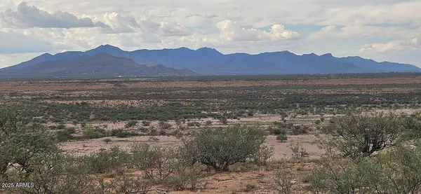 a view of a town with mountains in the background