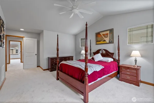 a bedroom with a bed and a lamp