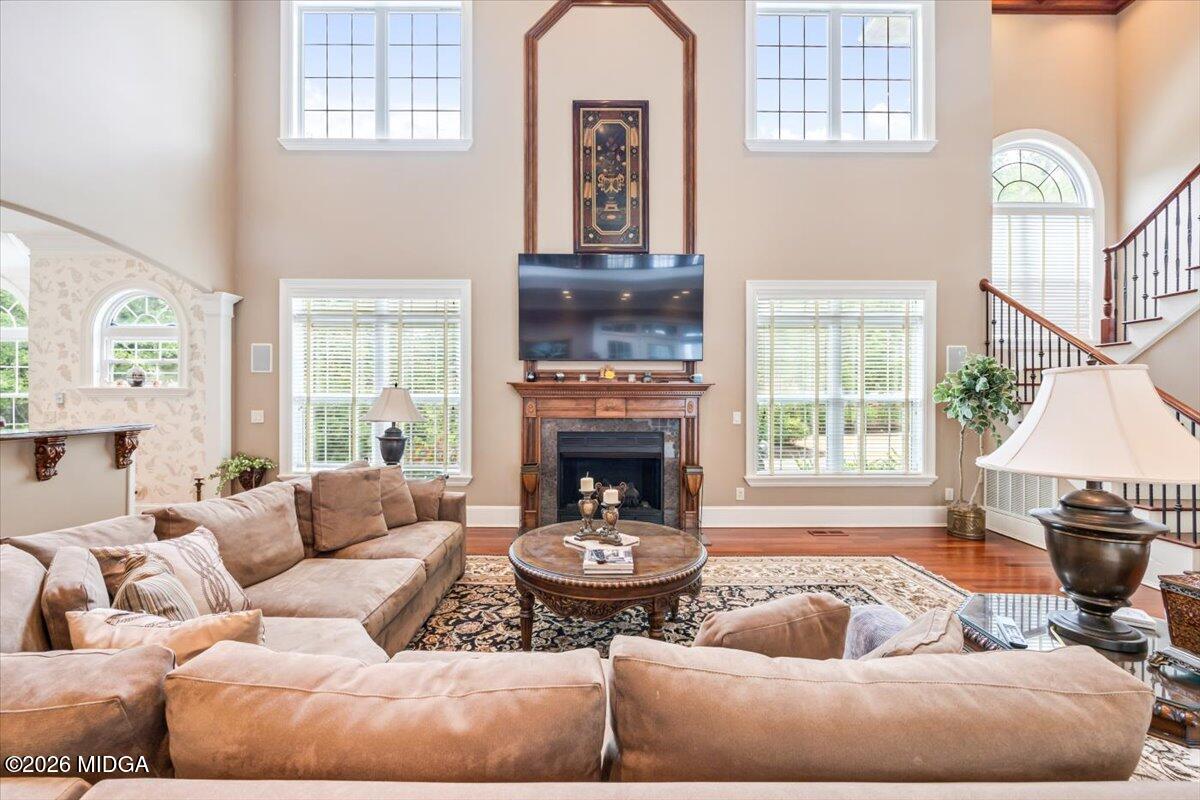 311 North Rivoli Farms Drive Macon, GA 31210 - Photo 13 of 79 a living room with furniture and a fireplace