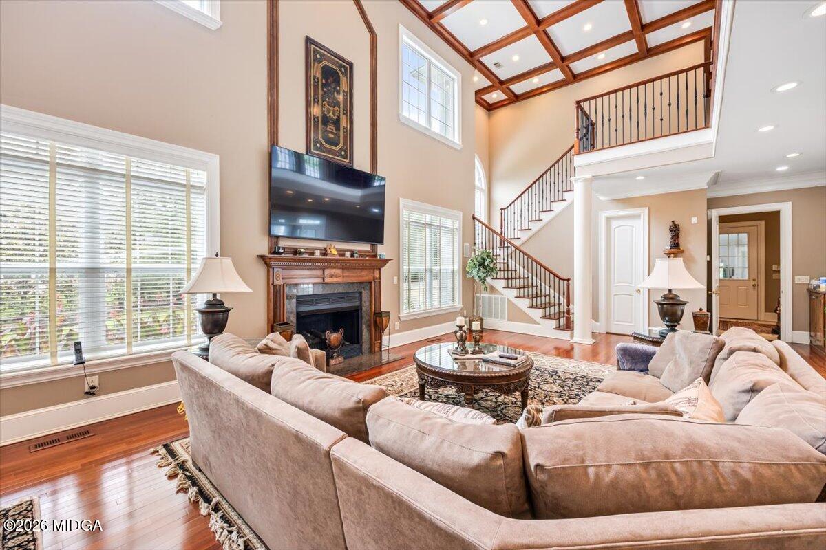 311 North Rivoli Farms Drive Macon, GA 31210 - Photo 14 of 79 a living room with fireplace furniture and a large window